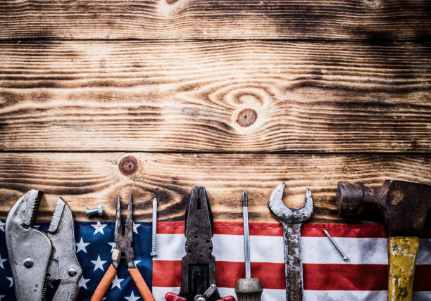 istock Happy Labor day. Construction tools. Copy space for text on wood background. 1022585454
