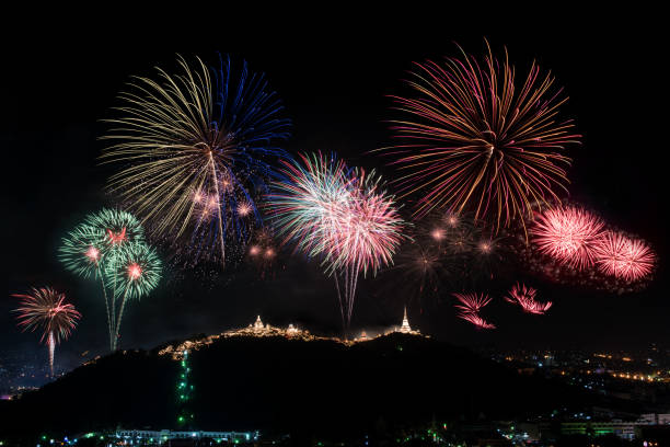 istock Beautiful colorful firework display on mountain dark sky for celebration night 1022587696