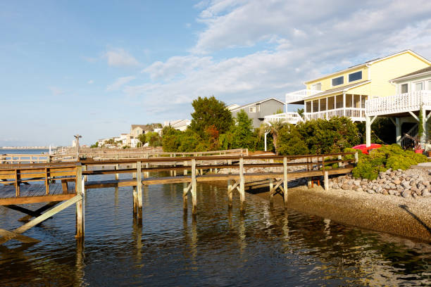 istock Homes on the canal with a long wooden dock 1022594802