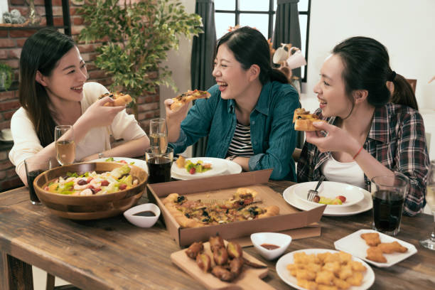 istock people enjoys pizza together at home 1022599948