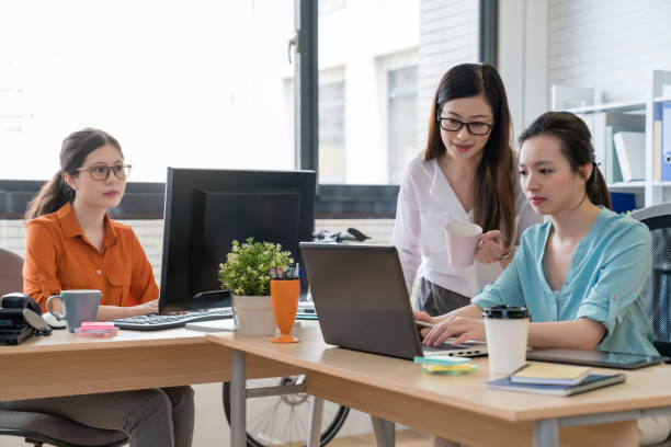 istock asia business people team concentrating on work 1022602308