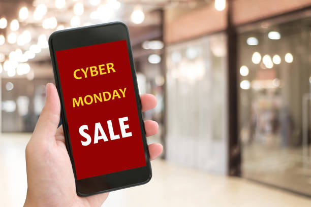 istock Hand using smart phone with cyber monday sale on screen device over blur background with copy space, business technology and lifestyle concept 1022602726