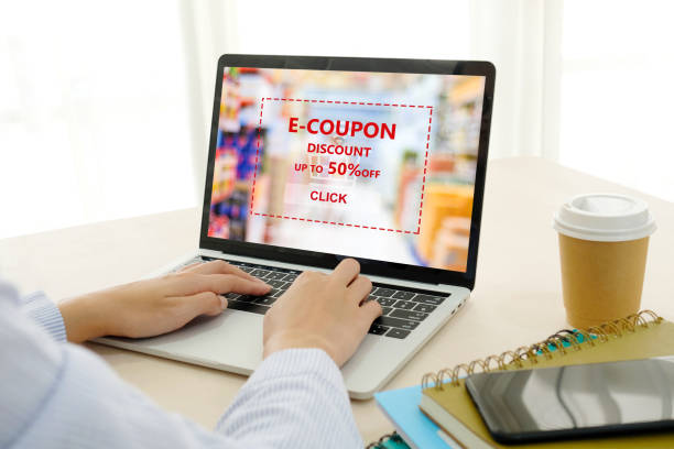 istock Woman hand using laptop computer with grocery E-coupon, discount coupon on screen, online shopping sale, digital marketing, business and technology concept 1022603046