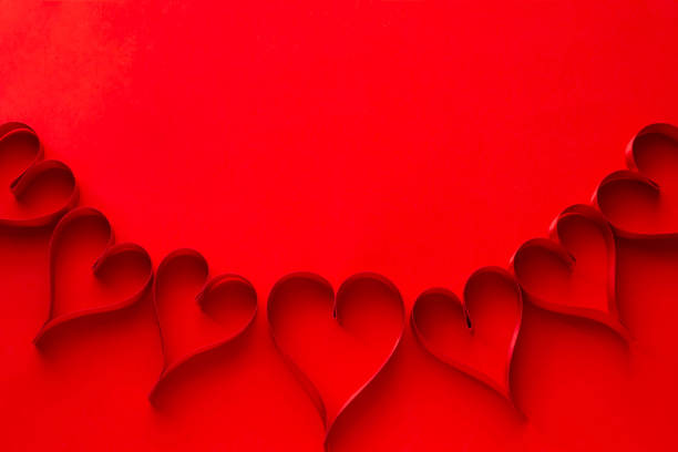 istock Image of affection Red background and ribbon and heart 1022625170