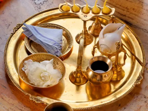 Puja tray and accessories for worship in the Hare Krishna temple.