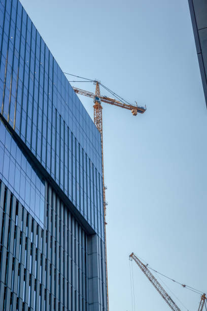istock Industrial Construction Crane and Clear Blue Sky 1022635872