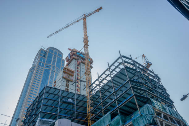 istock Industrial Construction Crane and Clear Blue Sky 1022635930