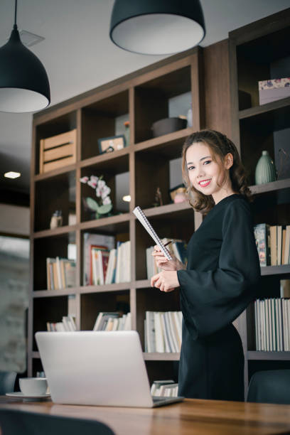 istock Confident happiness young woman working on laptop or notebook in her office. 1022638914