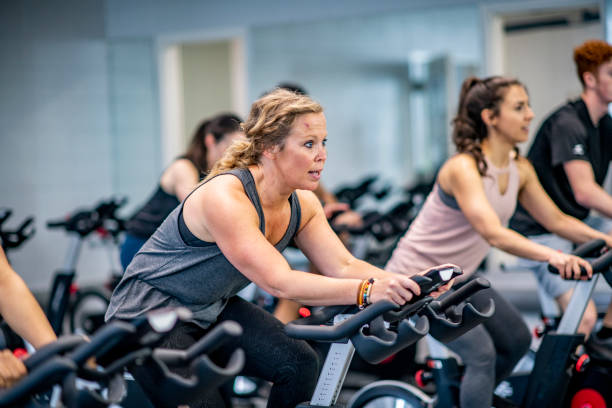 istock exercising in the gym as a group 1022651844