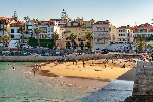 Public beach in Cascais, Portugal. Photo taken during a warm summer day and contains people.