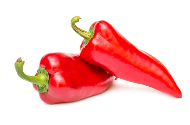 istock Two red sweet peppers on white. 1022676142