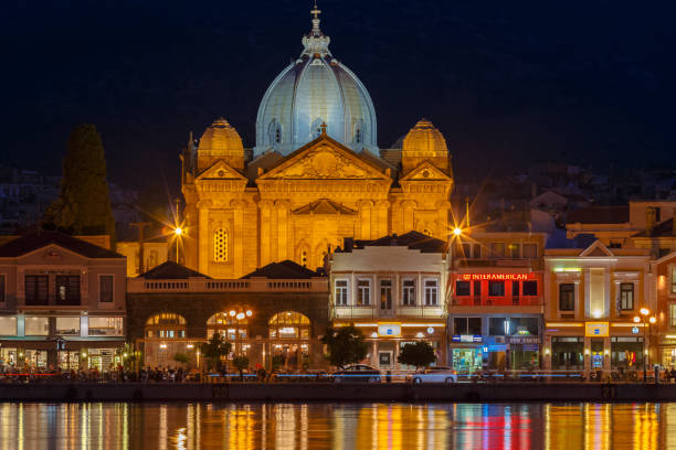 istock Mytilene seafront with St Therapontas cathedral temple in the evening against a clear sky with the street lights and reflections at sea 1022676268