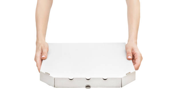 Woman's hands holding pizza box. Isolated on white.