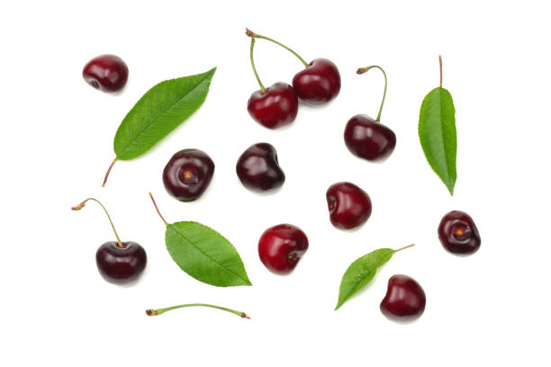 istock cherry with green leaf isolated on white background. Top view 1022679282