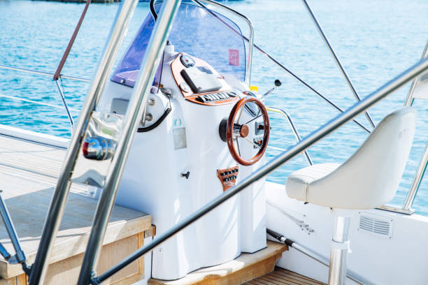 istock boat deck with steering wheel close up 1022679390