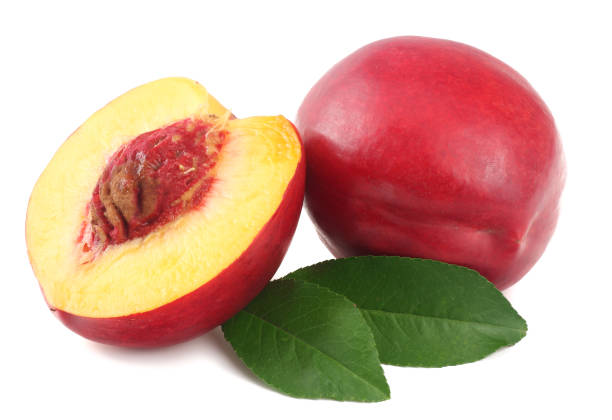 istock Nectarine with green leaf and slices isolated on white background 1022679434