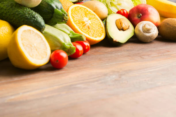 Autumn vegetables on wooden table with copy space