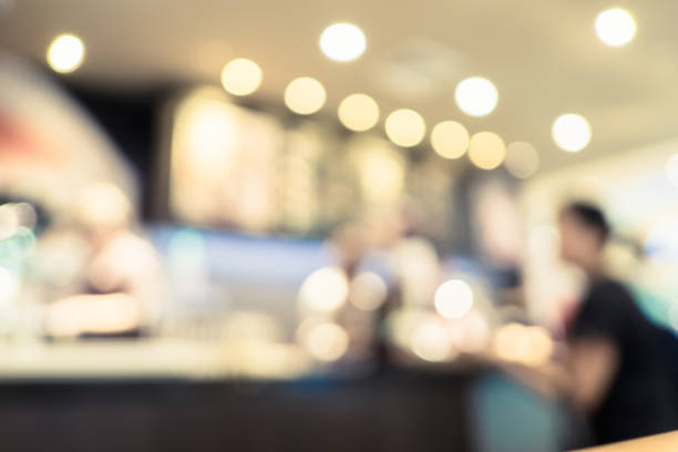 istock Blurred background people order menu in Coffee shop blur background with bokeh light.leisure lifestyle backdrop. 1022698838