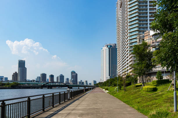 Landscape around Toyosu canal Photographing the scenery around Toyosu canal from the promenade along the river riverbank stock pictures, royalty-free photos & images