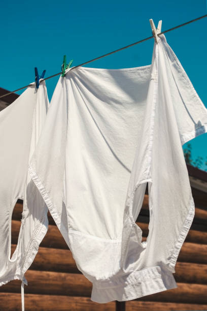 istock White clean clothes on the rope outdoors 1022708488