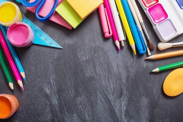 istock School stationery on background blackboard 1022710296