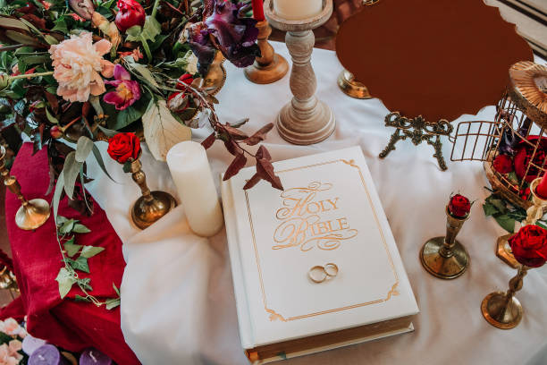 istock wedding rings bible decor flowers candles table 1022715090