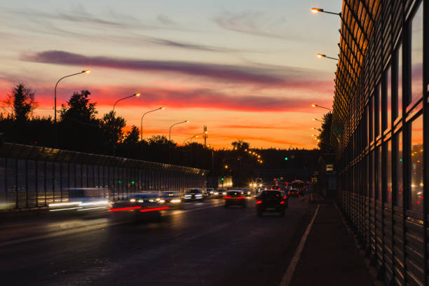 istock Summer landscape with highway and tracks from car headlights 1022720314