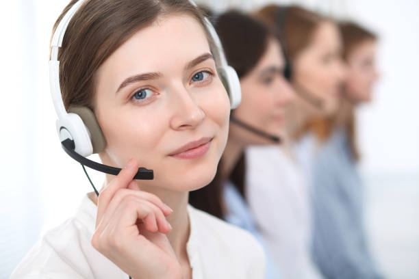 istock Call center. Beautiful cheerful smiling operator consulting clients with headset. Business concept of customer service. 1022723626