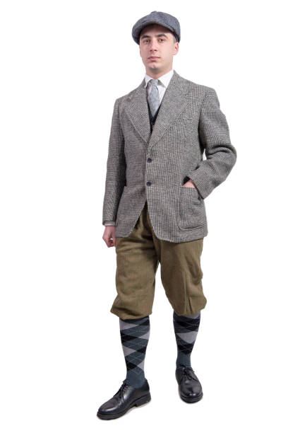 istock young man in vintage clothes with hat, 1930 style, on white 1022726948