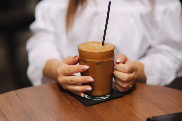 istock Cup of big latte portion. Close up hands hold cup 1022730916