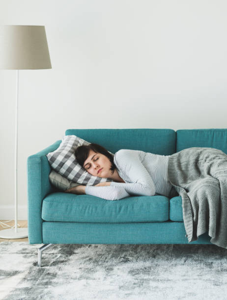 istock Woman sleeping on the sofa 1022741822