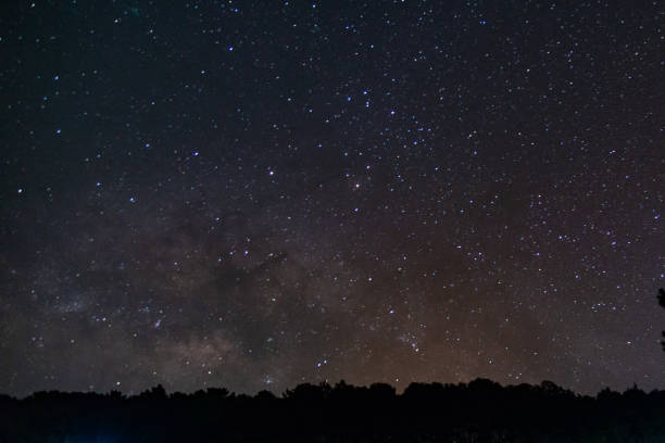 istock milky way galaxy, Long exposure photograph, with grain. 1022742456