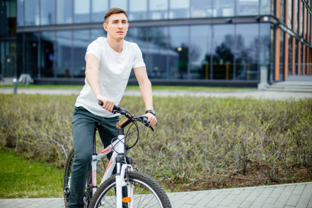 istock Handsome man hipster enjoying city ride by bicycle. 1022742990