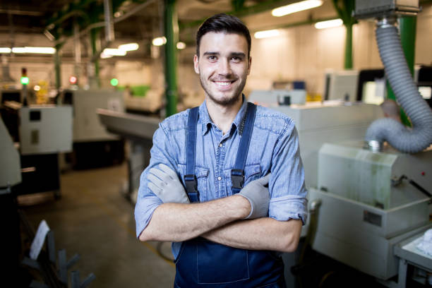 istock Young engineer standing in factory 1022746326