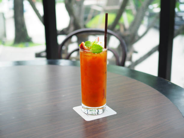 istock A glass of iced tea, decorated  mixed with passion fruit and lemon decorated with mint leaf and sliced passion fruit. Tropical refreshing mocktail. 1022749430