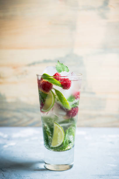 istock Raspberry mojito cocktail on the wooden background 1022749892