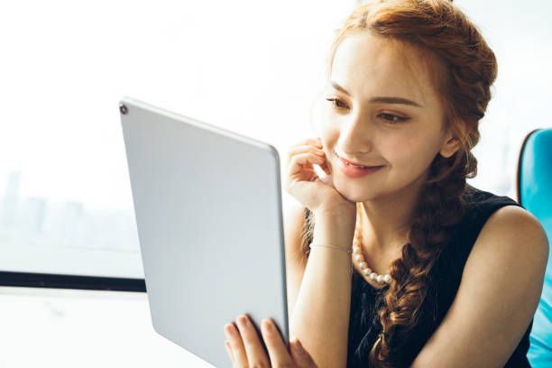 istock Beautiful Asian modern Businesswoman using digital tablet at office 1022753206