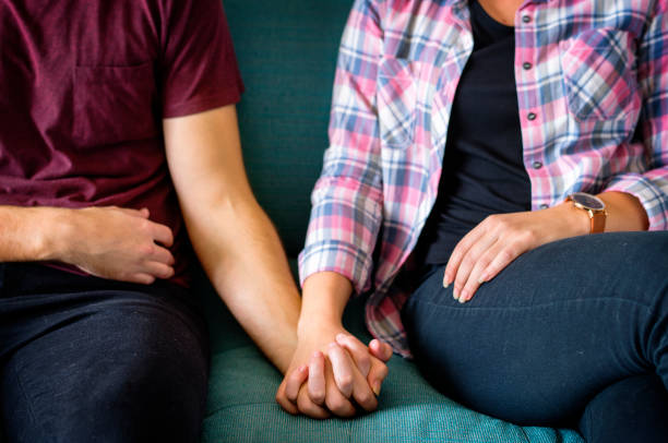 istock Closeup of couple holding hands 1022754328