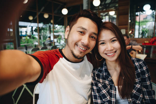 istock Happy couple taking selfie together 1022762718