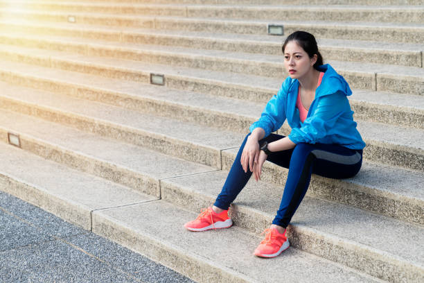 istock Female athlete taking a break from running. 1022764316