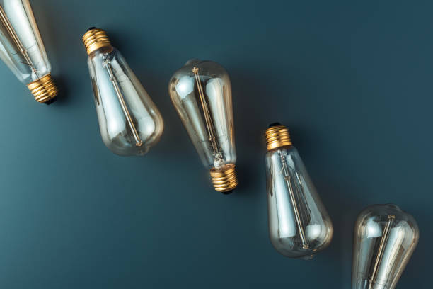 istock close-up view of light bulbs on grey background, energy concept 1022770176