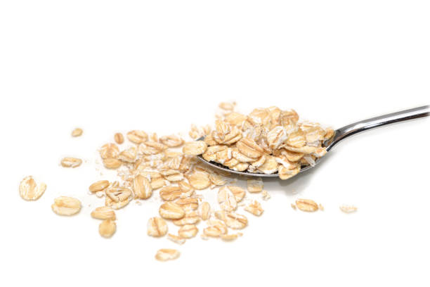 istock Dry rolled oatmeal on white background 1022775096