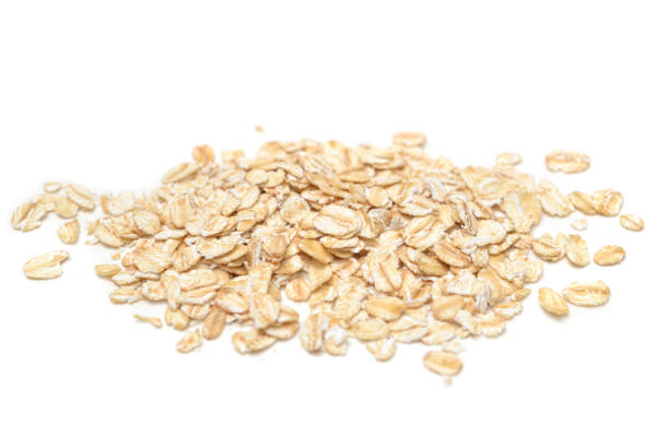 istock Dry rolled oatmeal on white background 1022775140