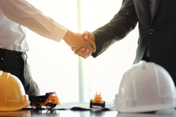 istock Businessman and engineer handshake for business cooperation. 1022775298