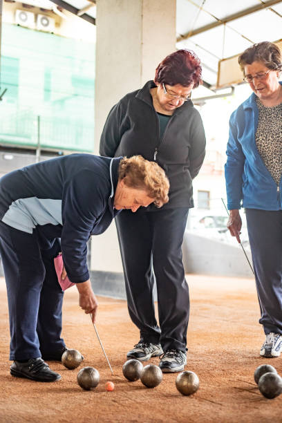 istock Senior Woman Marking Where Bocce Ball Has Stopped 1022775482