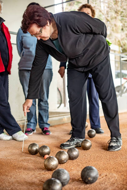 istock Senior Woman Marking Where Bocce Ball Has Stopped 1022775488