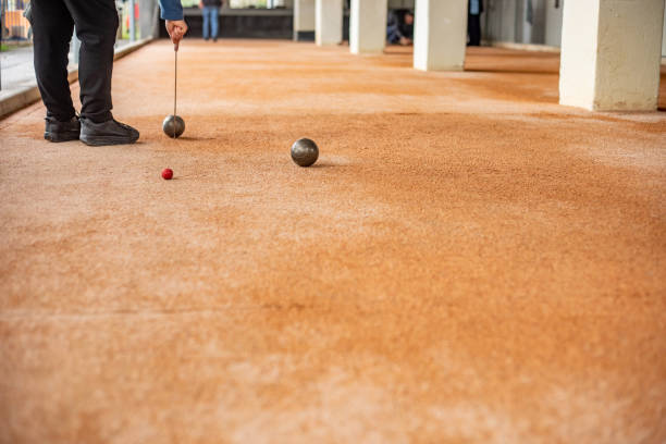 istock Senior Woman Marking Where Bocce Ball Has Stopped 1022775536