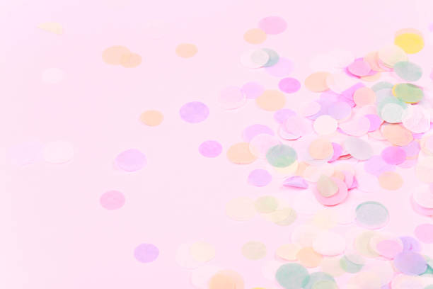 istock Vibrant confetti on pastel pink background 1022780766