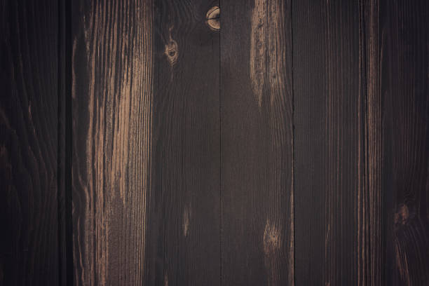 istock dark brown wood background 1022798300