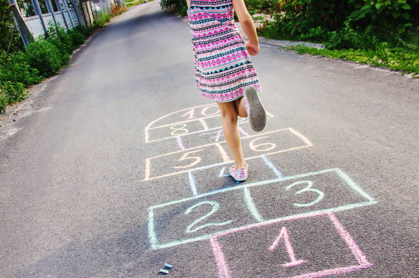 istock street children's games in classics. Selective focus. 1022800420